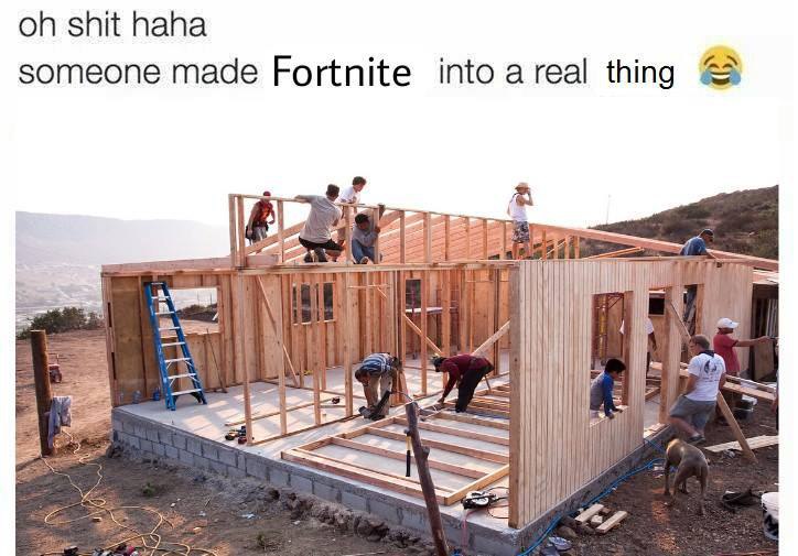 a group of people working on a house